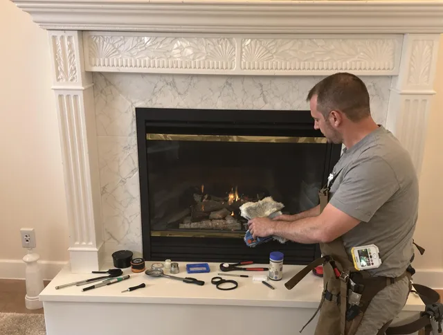 Valley Falls Chimney Sweep performing fireplace maintenance in Valley Falls, RI